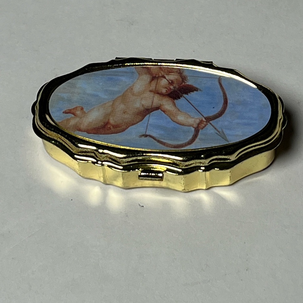 NWOT 4 small metal sewing kits. Cherub on top of kit.  Perfect for gifts!